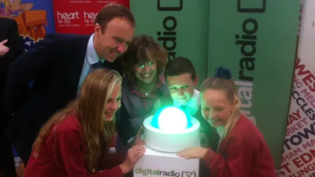 MP Matt Hancock and school children at the switch on