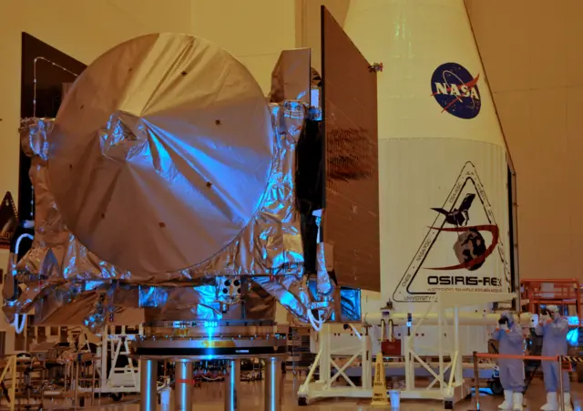 The Osiris-Rex spacecraft sits on its workstand in a servicing building at Kennedy Space Center, Florida