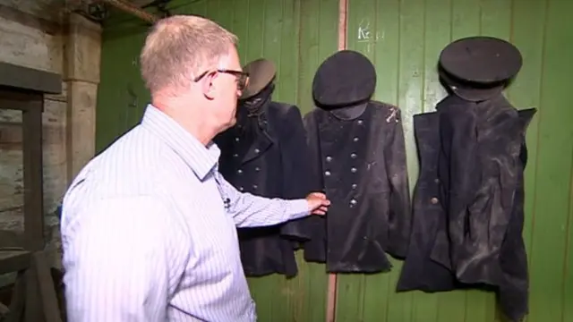 David Jasper inspects his father's old uniform