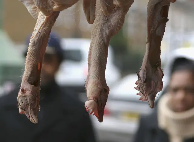 Chickens upside down at butchers