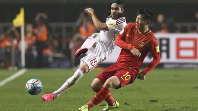 Alaa Al Shbbli of Syria and Zhang Xizhe of China in action.