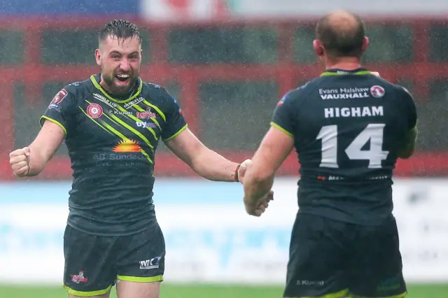 Micky Higham and Gregg McNally celebrate Leigh's promotion