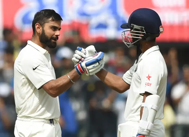 Virat Kohli (left) celebrates with Ajinkya Rahane