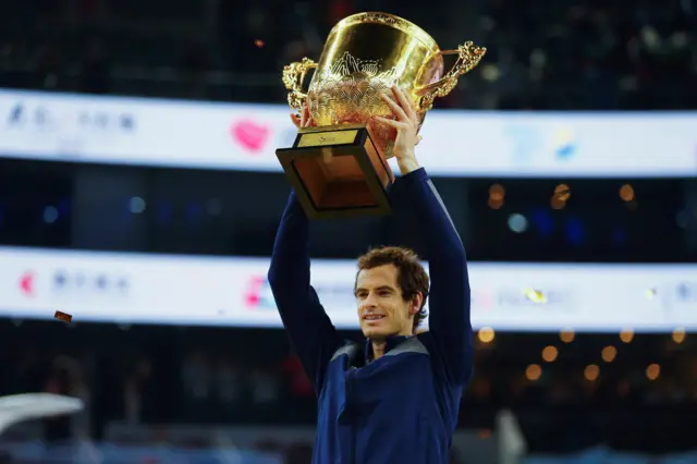 Andy Murray holds his trophy aloft