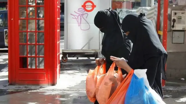 Muslim walking in a street