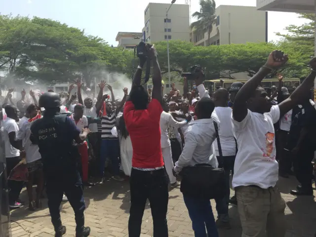 People celebrating outside court