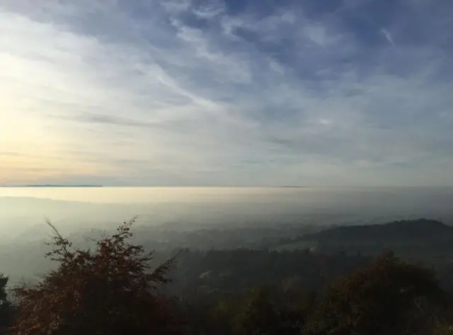 Mist can be seen settling from the Malvern Hills