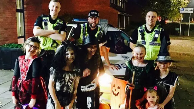 Police with trick or treaters