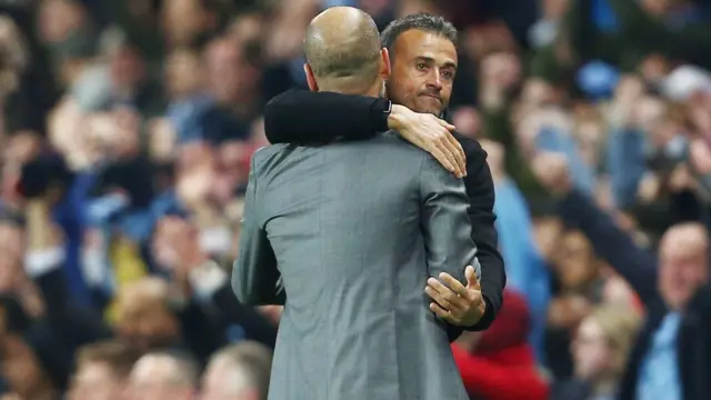 Luis Enrique hugs counterpart Pep Guardiola