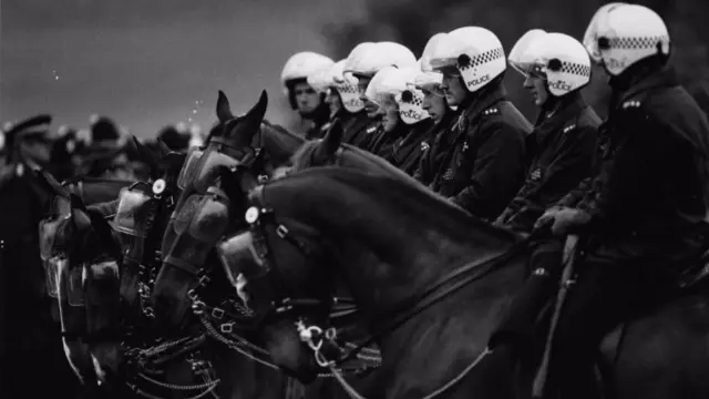 Mounted riot police line up at Orgreave, 2 June 1984.