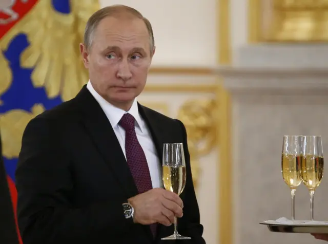 Russian President Vladimir Putin makes a toast during a ceremony for receiving diplomatic credentials from foreign ambassadors in the Kremlin in Moscow, Russia.