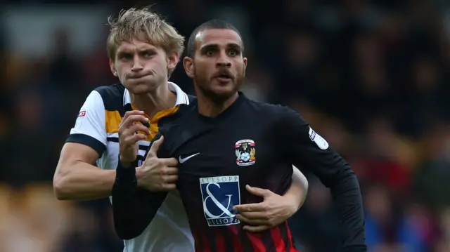 Port Vale's Nathan Smith and Coventry City's Marcus Tudgay