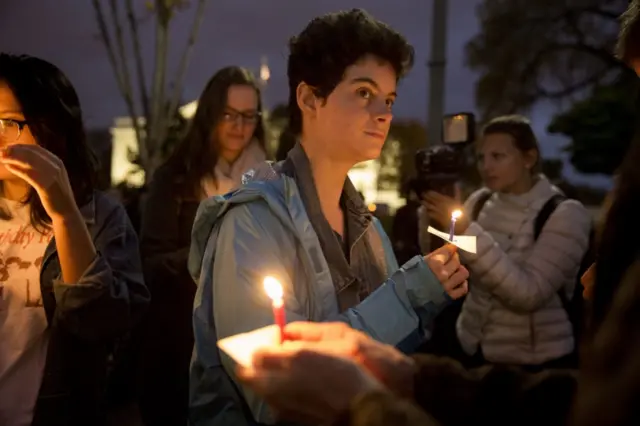 People attend a candlelight vigil after Hillary Clinton"s loss to Donald Trump in the 2016 presidential election, on Pennsylvania Avenue outside the White House