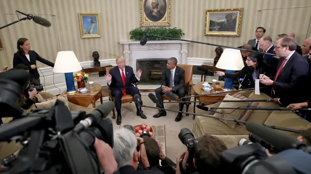 President-elect Donald Trump (L) talks after a meeting with U.S. President Barack Obama (R) in the Oval Office November 10, 2016