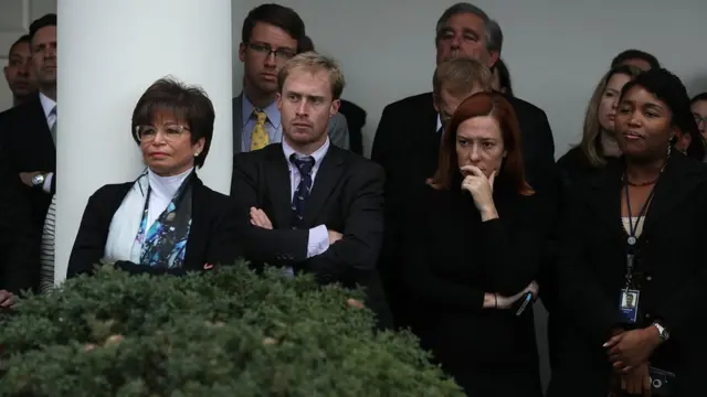 White House staffers watch as Obama speaks to the nation on Wednesday