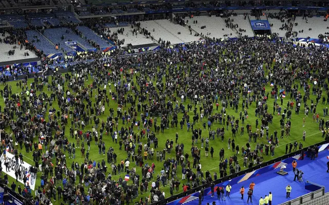 Fans on pitch at Stade de France