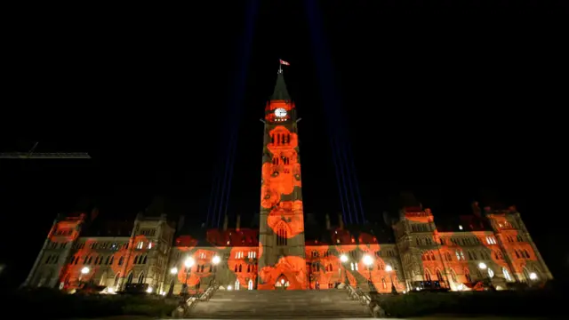 Poppies are projected on Centre Block as part of the Royal Canadian Legion"s "virtual poppy drop" on Parliament Hill, ahead of Remembrance Day, in Ottawa, Ontario, Canada, November 10, 2016.