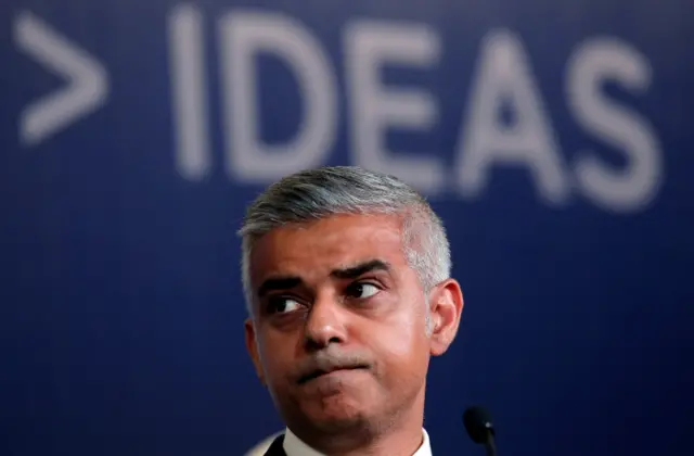 Mayor of London Sadiq Khan under a sign saying 'ideas'