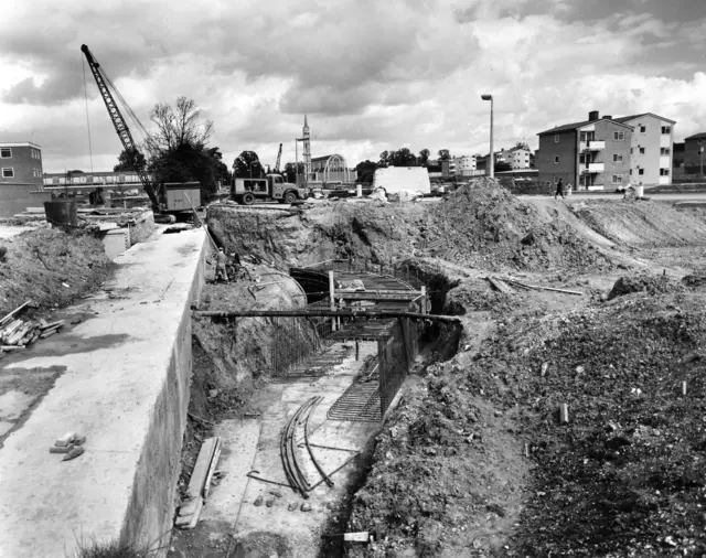 Post-war construction in Stevenage. A crane hovers over a building site.