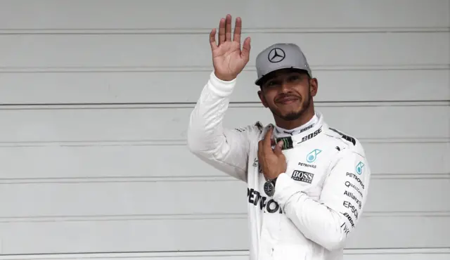 Lewis Hamilton celebrates securing pole position