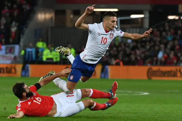 Joe Ledley vies with Serbia's forward Dusan Tadic