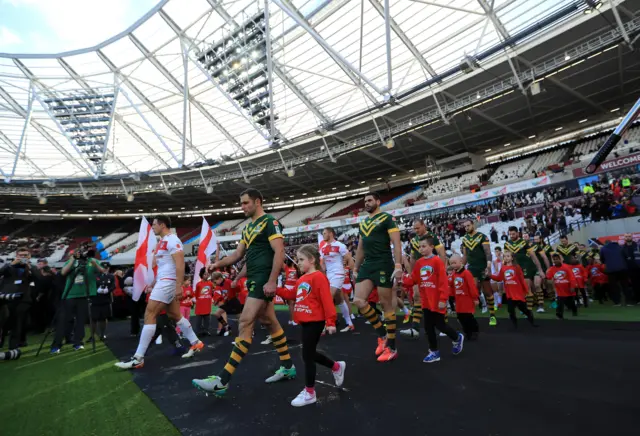 England and Australia walk onto the pitch