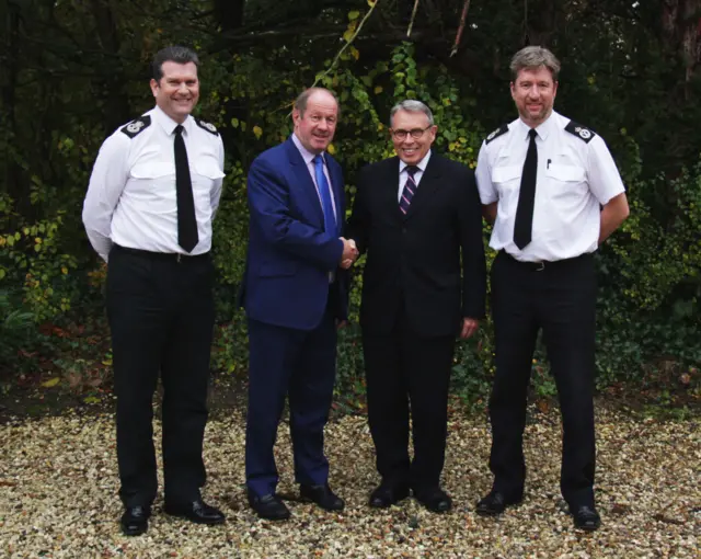 Gareth Wilson, Tim Passmore shaking hands with Lorne Green, Simon Bailey standing together