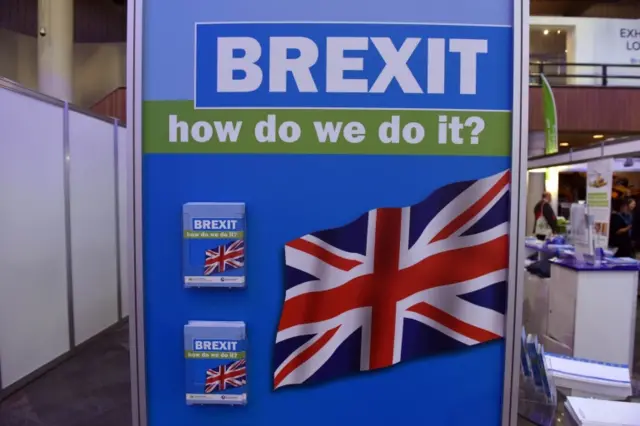 A sign reads 'Brexit: how do we do it?' at the Tory party conference