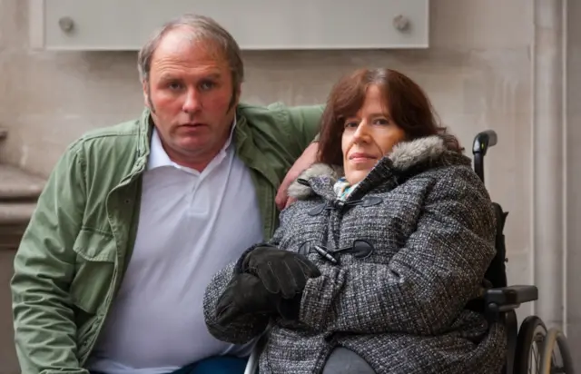 Jacqueline Carmichael and her husband Jayson from Southport, Merseyside, outside the Supreme Court, in London