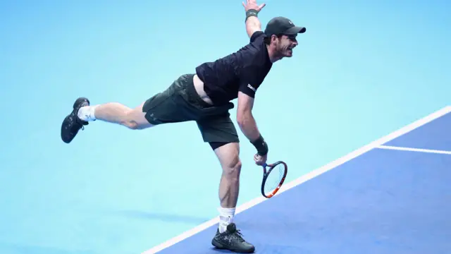 Andy Murray serves