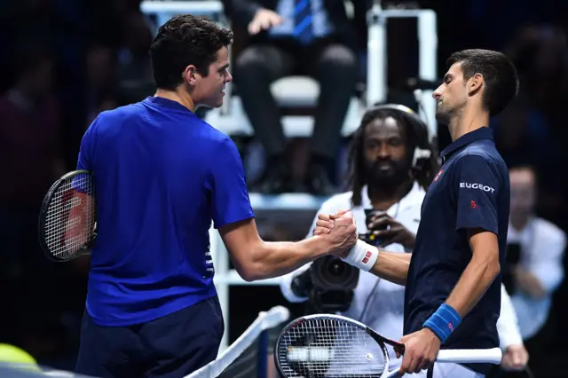 Novak Djokovic and Milos Raonic shake hands