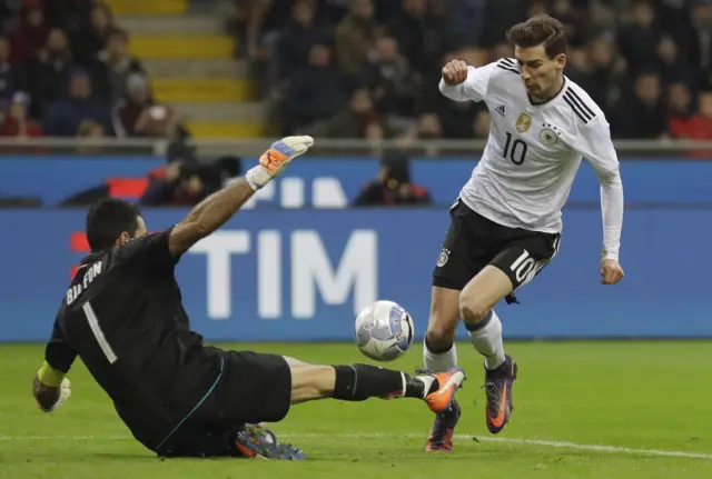 Italy's Gianluigi Buffon wins the ball from Germany's Leon Goretzka