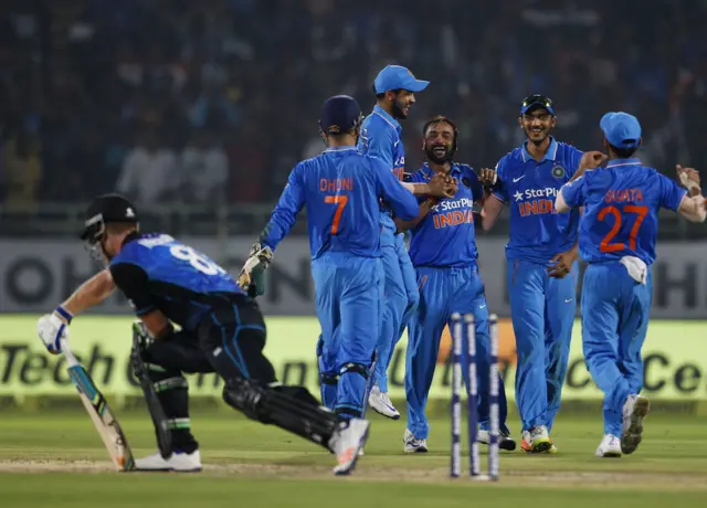 India's Amit Mishra celebrates a wicket against New Zealand