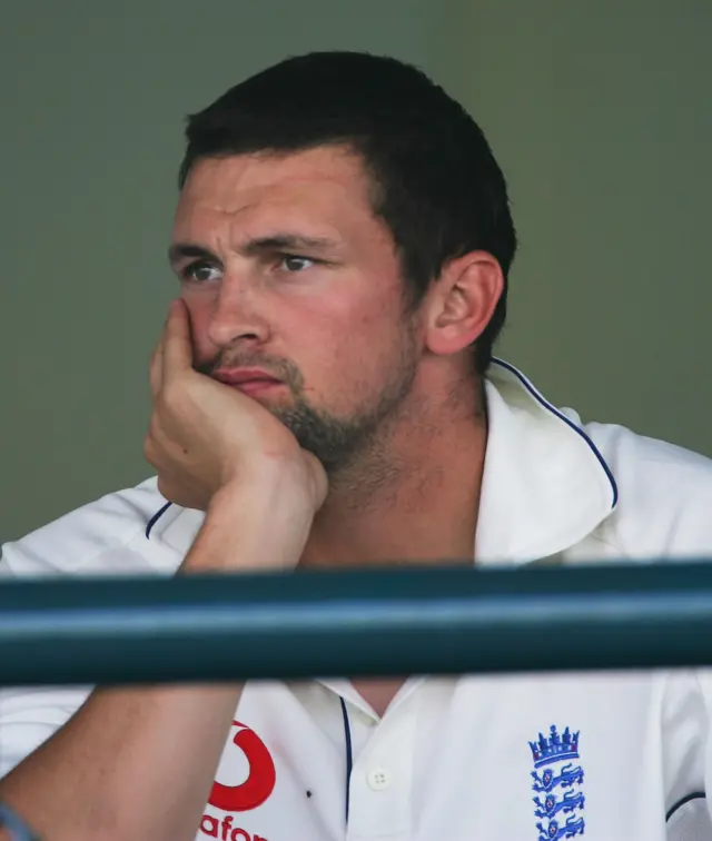 Steve Harmison looks from the team balcony after England were beaten by Pakistan