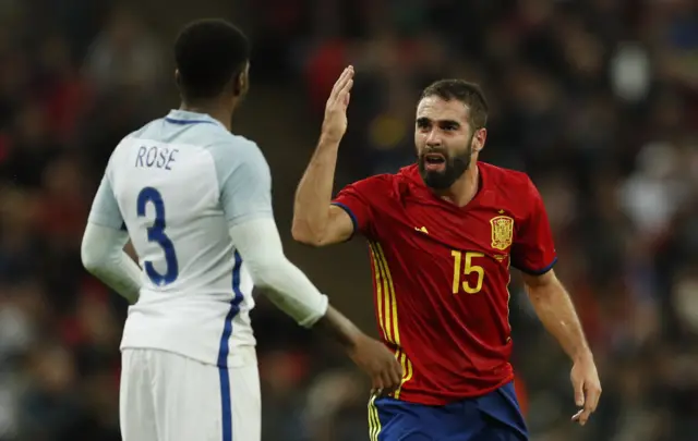 Dani Carvajal gestures to Danny Rose