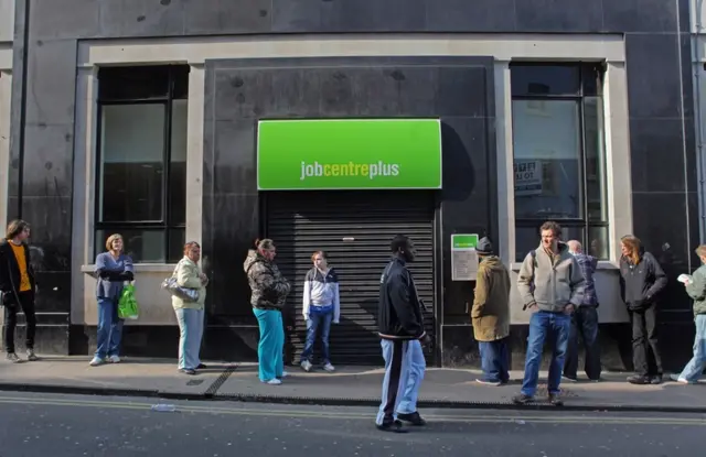 People queue outside a Job Centre in Bristol