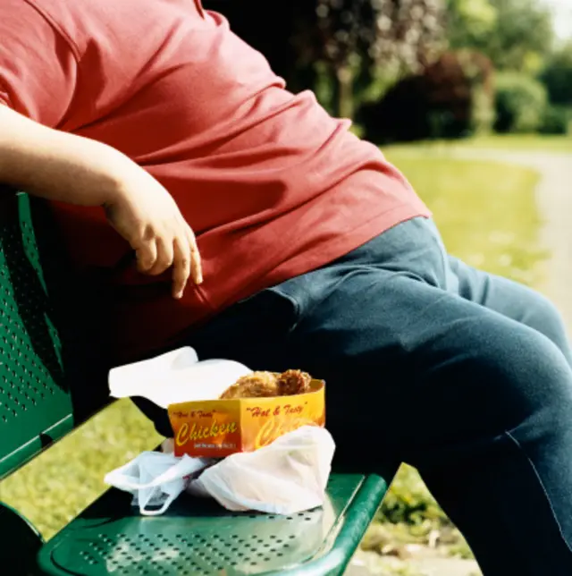 Man sat with fried food