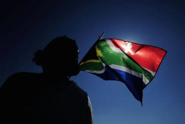 : A South Africa flag is waved