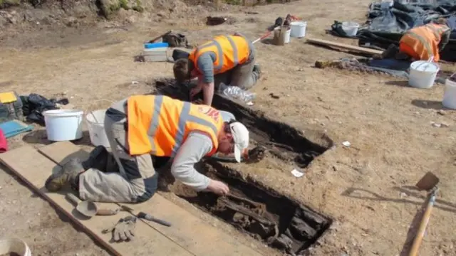 Archaelogists at the burial site