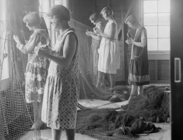 Women repairing the fishing nets