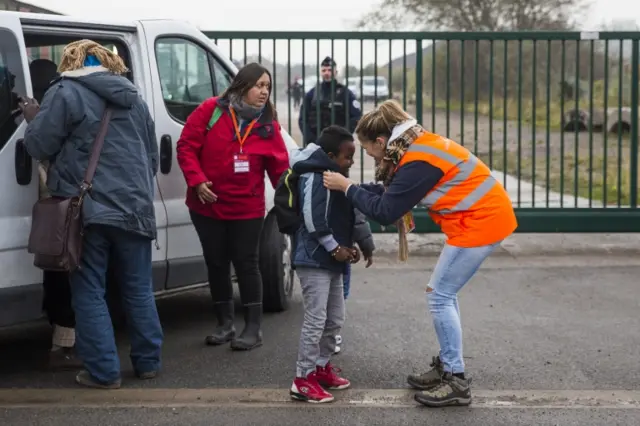 Children leave the jungle refugee camp In Calais