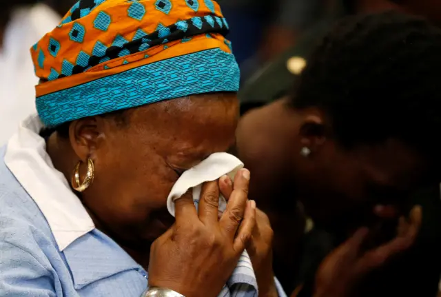 victim's mother weeps