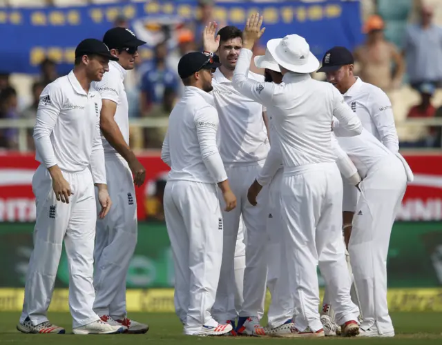 England celebrate after the dismissal of Vijay