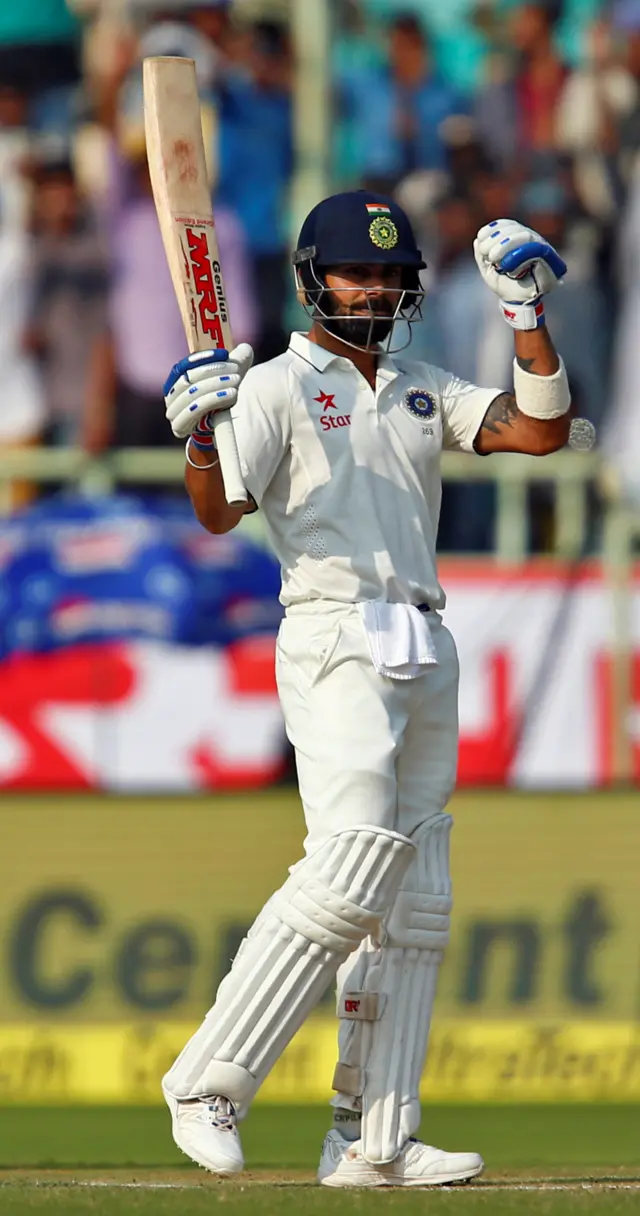 Virat Kohli celebrates