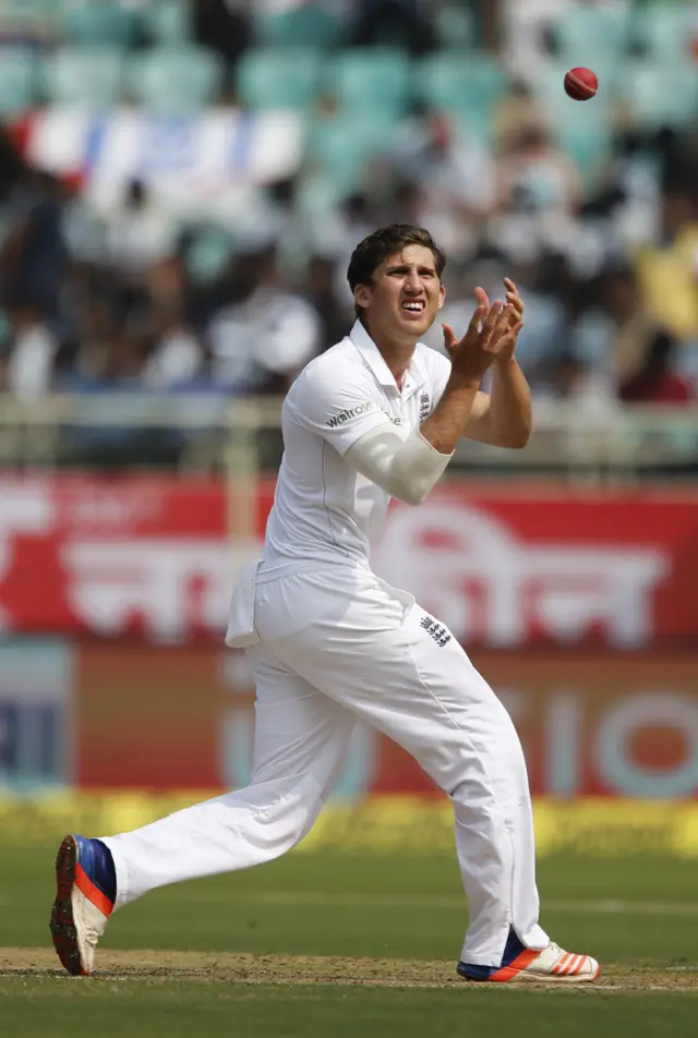 Ansari catches the ball before bowling his next shot