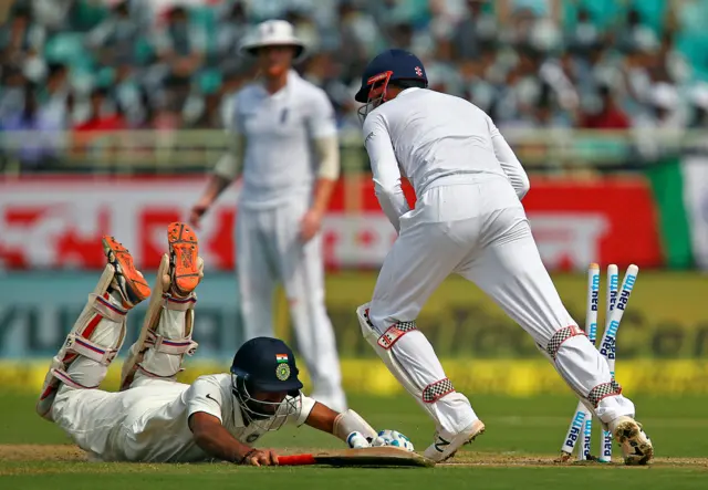 Pujara dives to avoid being run out