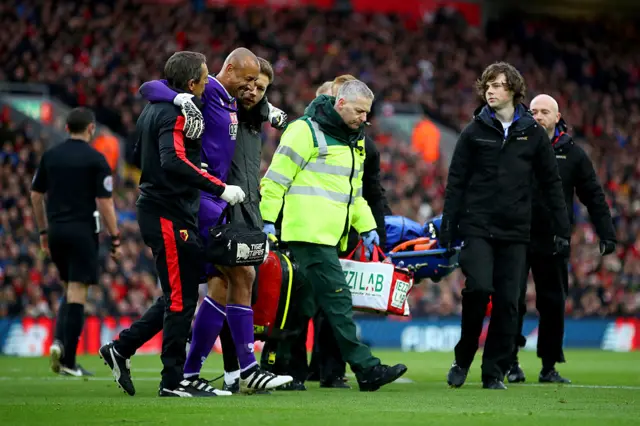 Heurelho Gomes is led from the pitch after being injured