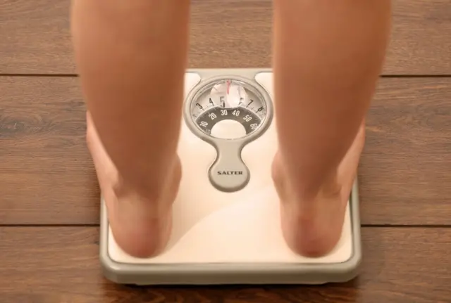 person on scales