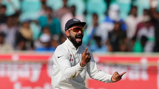 India's captain Virat Kohli celebrates the dismissal of England's Haseeb Hameed