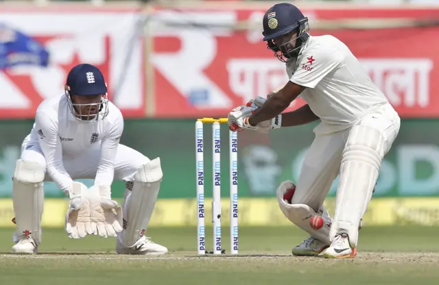 Ashwin prepares to take a shot